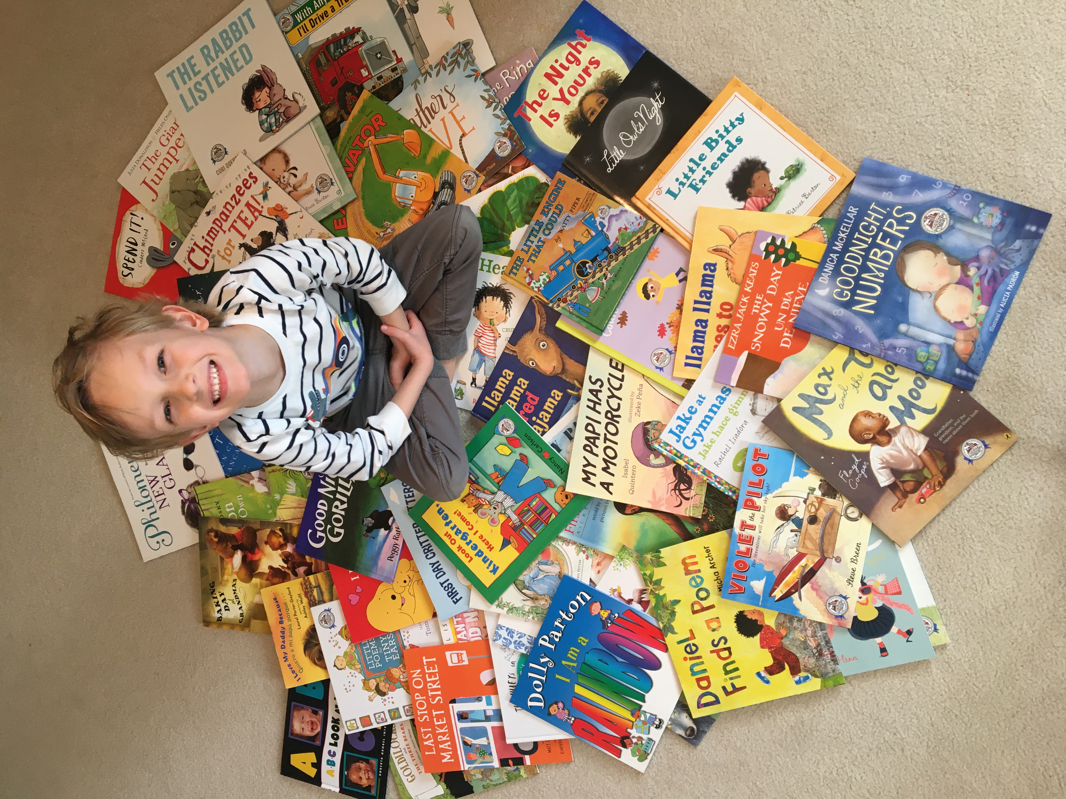 Will pictured with his collection of Imagination Library books, gifted from birth to age five