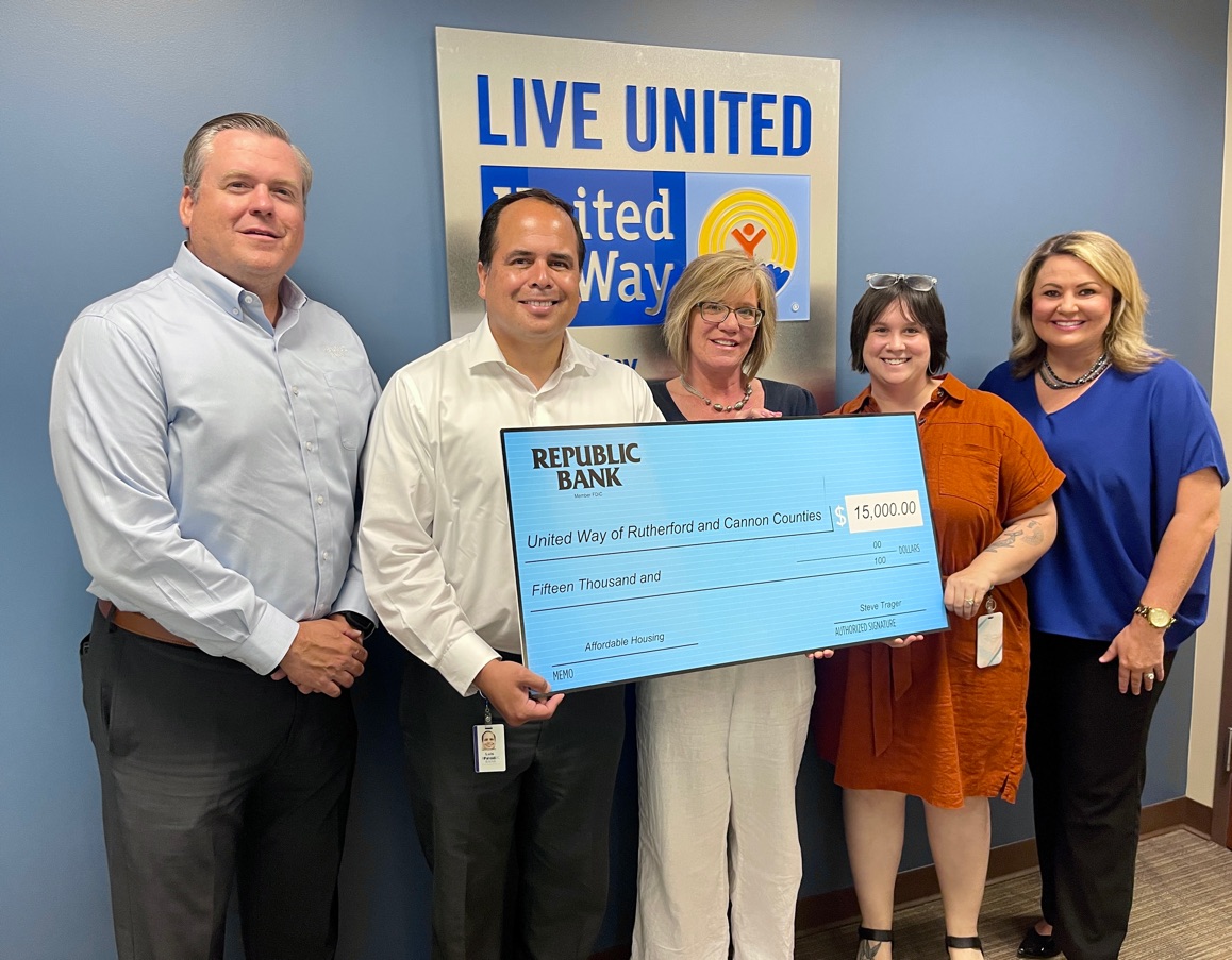 Representatives from Republic Bank and United Way holding large check